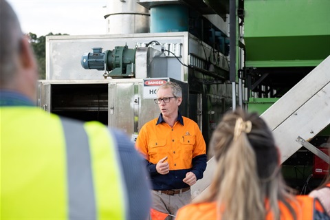 An Earth Systems representative talking at the opening.