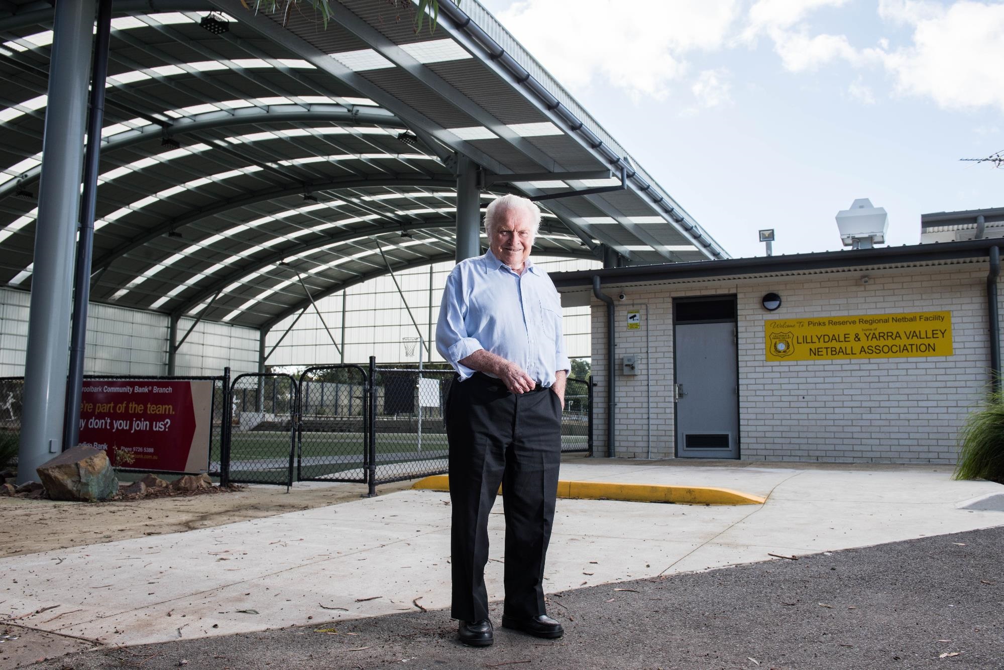 Cr Len Cox in front of netball facilities in Pinks Reserve