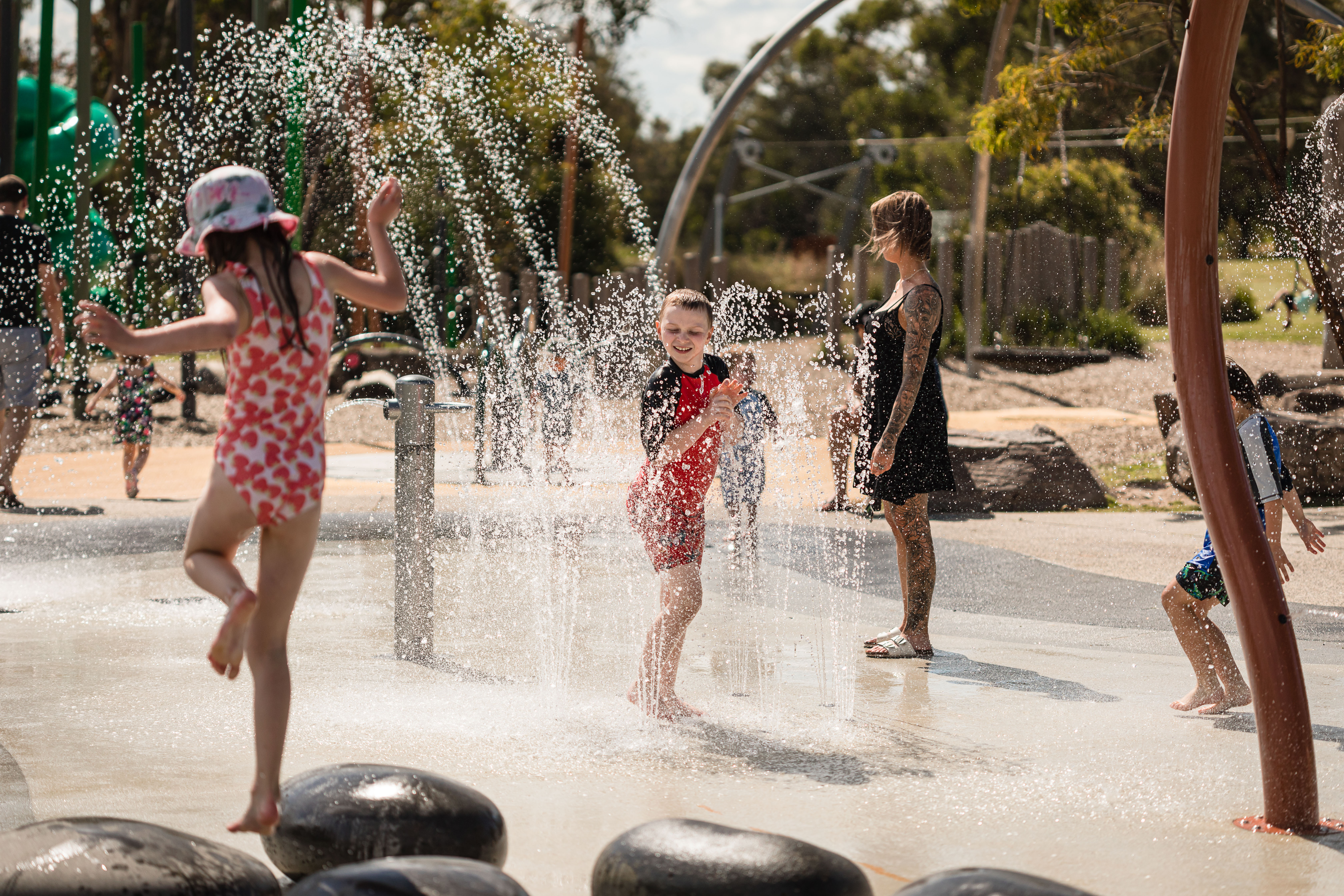 Children playing at the Lillydale Lake Water Play Park.