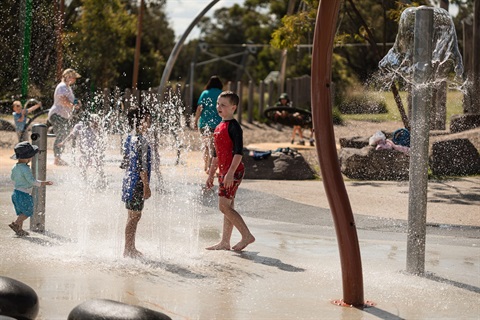 Kids play at the Lillydale Lake Water Play Park.