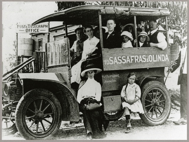 A photo of a bus, full of people, with Sassafras-Olinda written on the side.