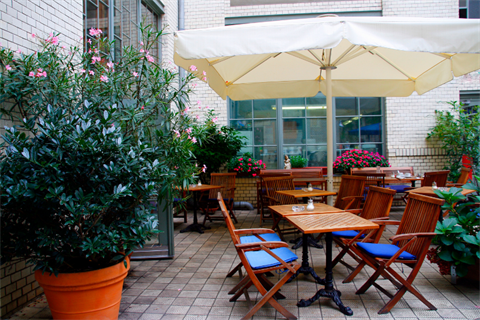Outdoor table chairs and umbrella