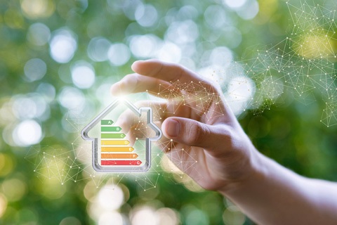 person holding an icon of a house with a rating