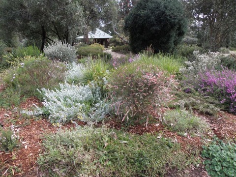 Gardens at Karwarra with the gatehouse in the distance