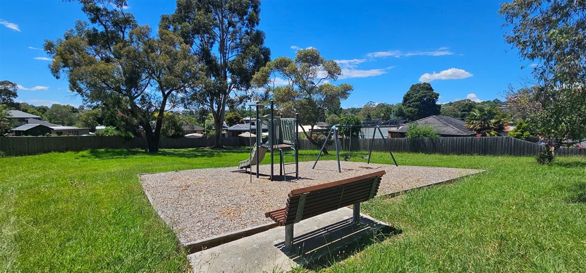 Seat with view of play equipment