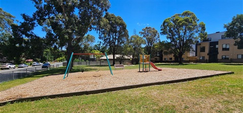 Play space with play equipment 