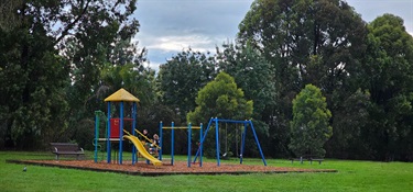 Play equipment with tower, slides and swings