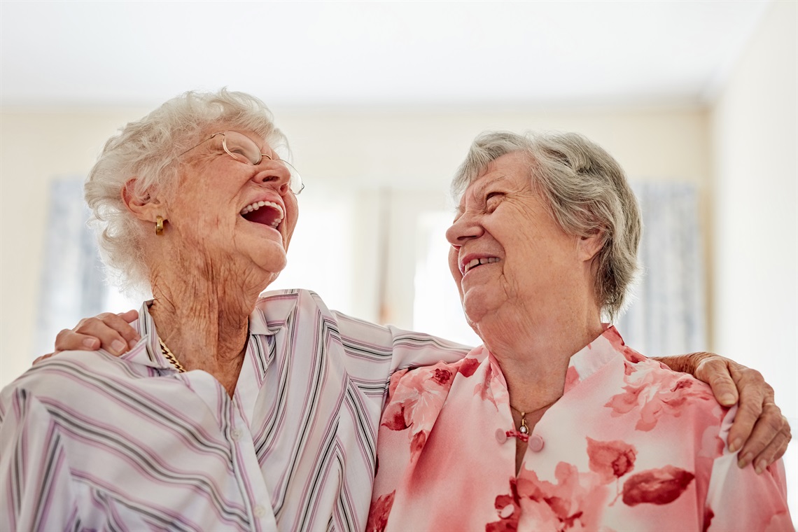 elderly ladies laughing together